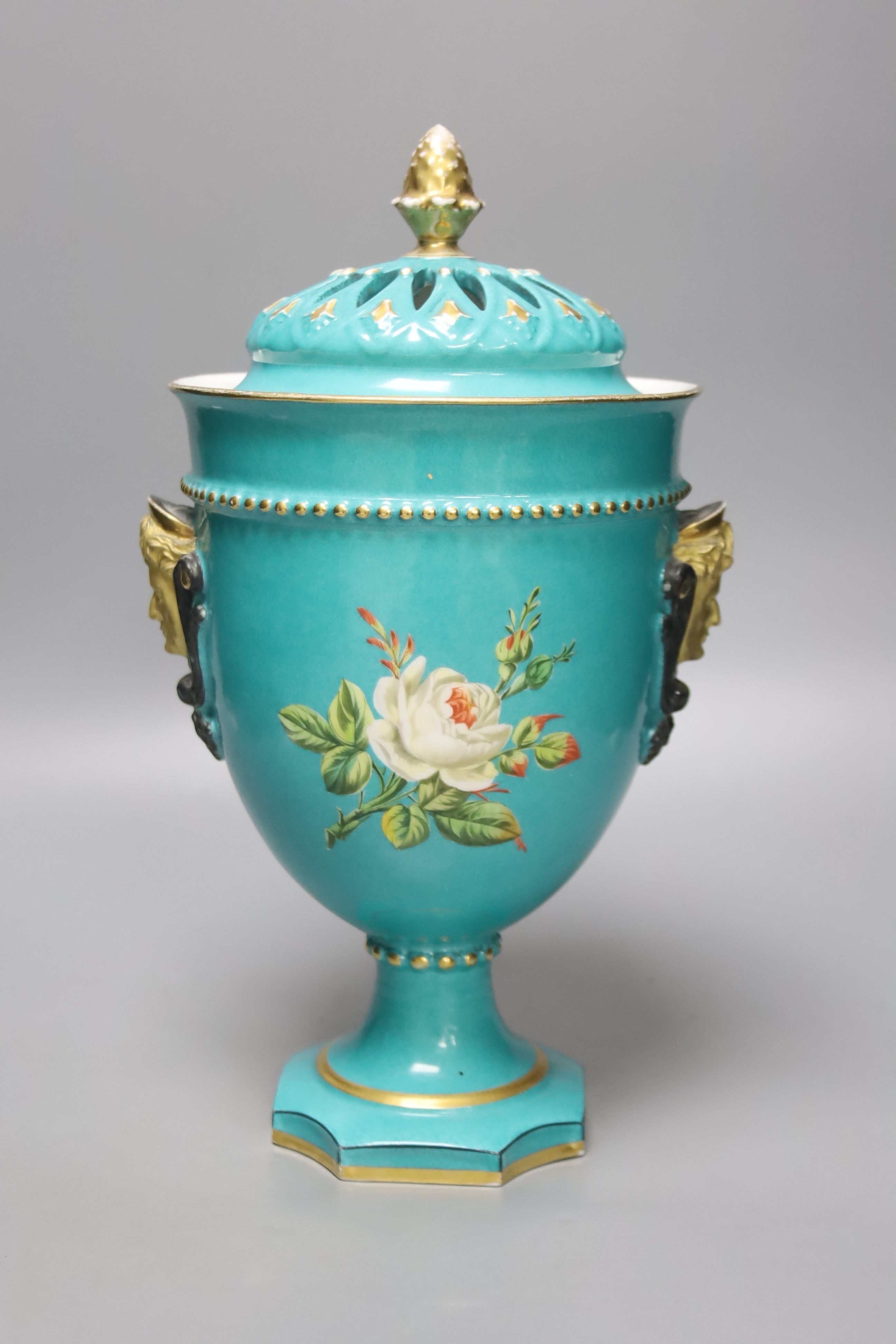 A 19th century French porcelain pot pourri vase, turquoise green ground with a pierced cover, height 30cm overall